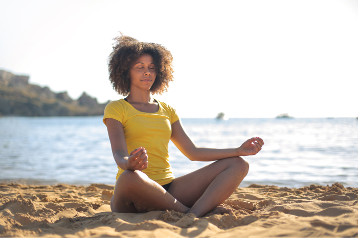 Woman Sitting In The Beach